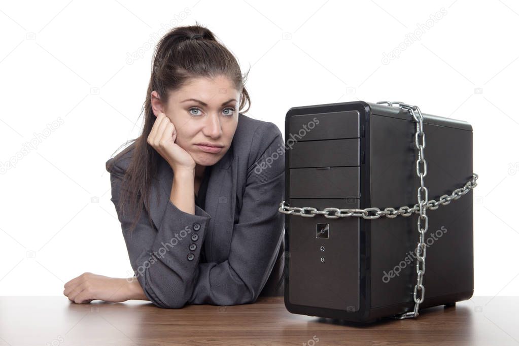 Computer locked up and business woman not looking very happy unsure what to do.