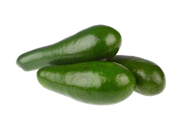 Зеленый авокадо на белом — стоковое фото