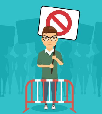 Onun elinde bir posteri ile mitingde bir protestocu.