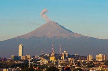 Popocatepetl Volcano over town clipart