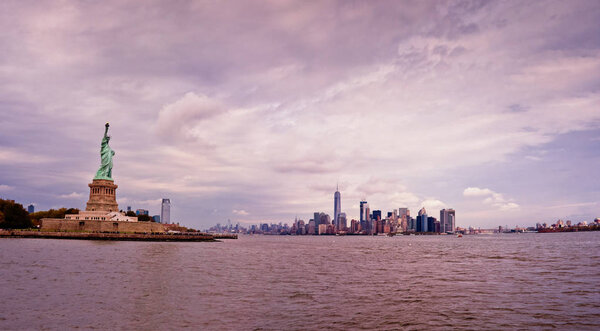 Statue of Liberty and Manhattan skyline panorama., New York City