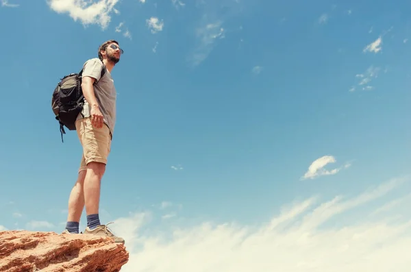 Hiker in mountains against sky