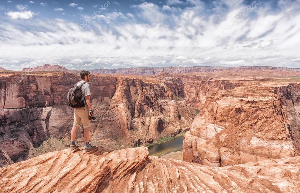 traveler looks at Horseshoe Bend in Utah, USA