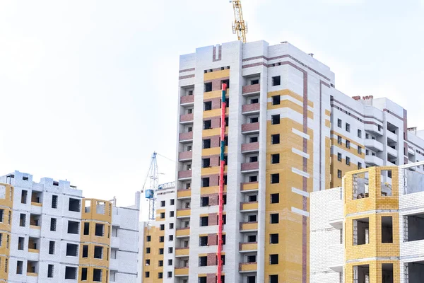 unfinished construction of residential buildings, tower cranes a