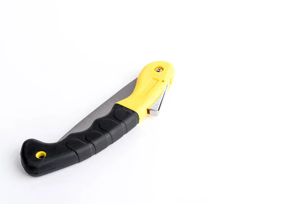 Folding garden hacksaw black-yellow saw on white background, saw — Stock Photo, Image