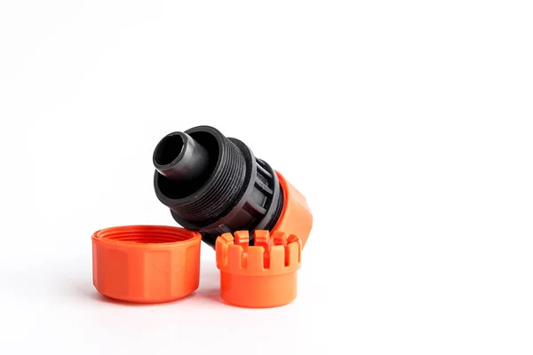 Orange garden water hose nozzle and connectors isolated on white