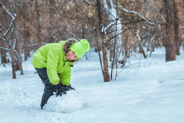 Cheerful happy boy playing in winter park, — Stock Photo, Image