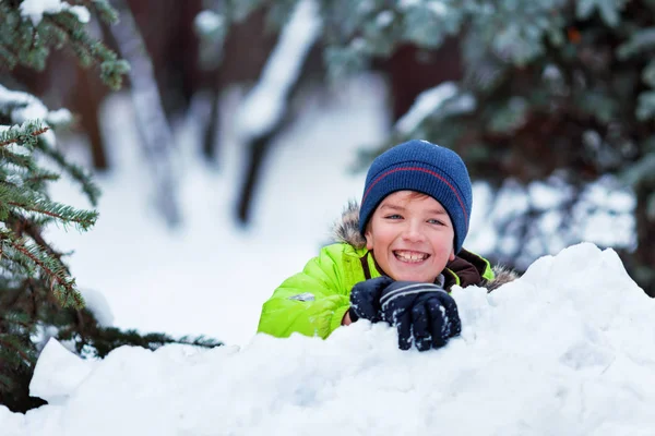 Cheerful happy boy playing in winter park, — Stock Photo, Image