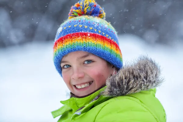 Cheerful happy boy playing in winter park, — Stock Photo, Image