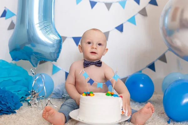 Baby's birthday in the decorated area, portrait of a happy boy