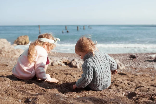 Two Girls Play Sand Seashore Children Wearing Sweaters Spring Outdoor — Stock Photo, Image