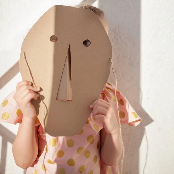 Portrait Girl Child Hides His Face Cardboard Mask Indoor — Stock Photo, Image