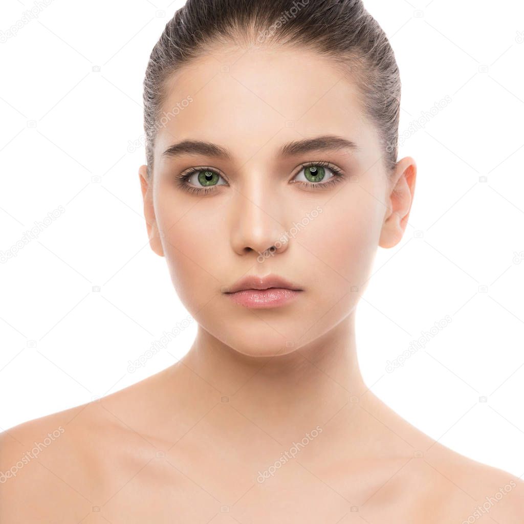 Portrait of beautiful young brunette woman with clean face. Isolated on a white.