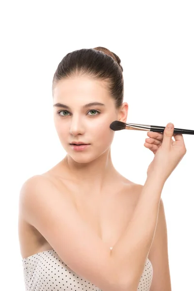 Young brunette woman with clean face. Girl perfect skin applying cosmetic brush. Isolated on a white. — Stock Photo, Image