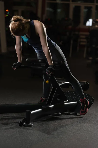 Woman doing strength exercises for abs muscles