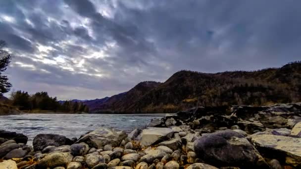 Time lapse shot of a river near mountain forest. Huge rocks and fast clouds movenings. Horizontal slider movement — Stock Video