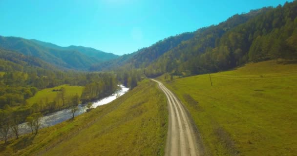 Low altitude flight over fresh fast mountain river with rocks at sunny summer morning. — Stock Video