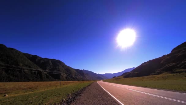 Mountain road timelapse at the summer or autumn sunset sunrise time. Wild nature and rural field. — Stock Video