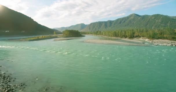 Low altitude flight over fresh fast mountain river with rocks at sunny summer morning. — Stock Video