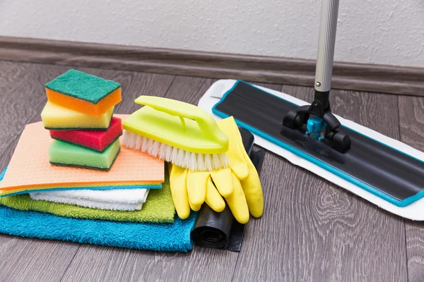 House cleaning equipment and accessories on the laminate floor — Stock Photo, Image