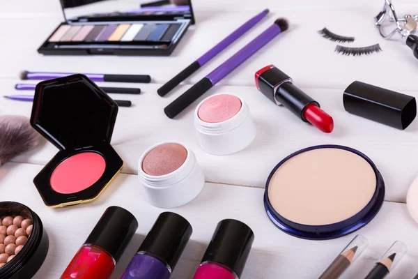 Closeup of makeup cosmetics on wooden table — Φωτογραφία Αρχείου