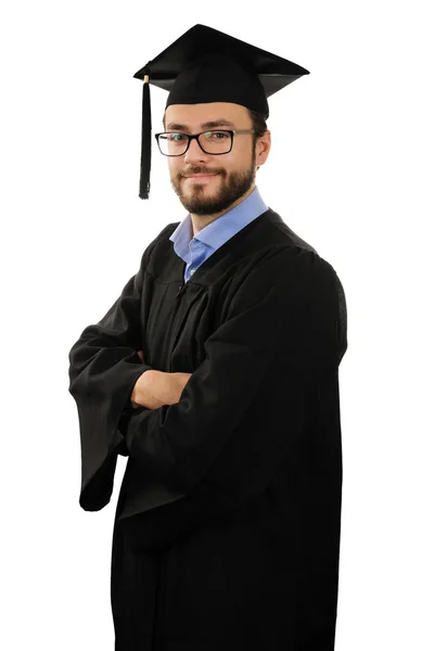 Estudante graduado vestindo vestido e boné isolado no fundo branco — Fotografia de Stock