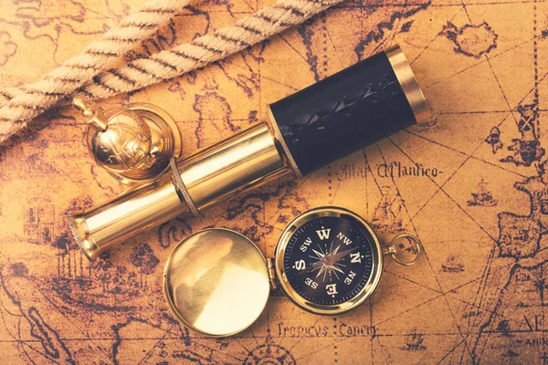 Vintage navigation equipment on old world map. top view — Stock Photo, Image