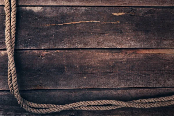 Oude schip touw op houten plank achtergrond — Stockfoto
