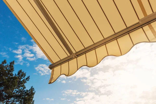 Awning against blue sunny sky — Stock Photo, Image