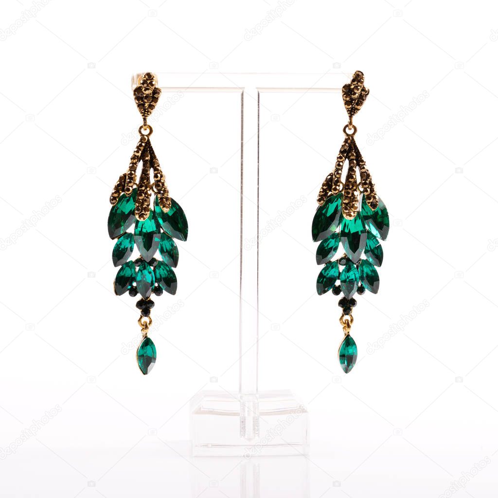 earrings on stand isolated on white background