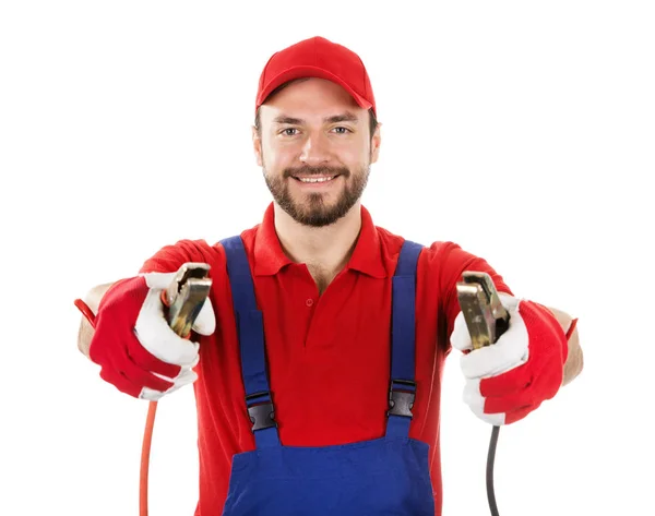 Smiling car mechanic with jumper cables isolated on white backgr — Stock Photo, Image