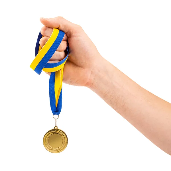 Złoty medal w ręku na białym tle — Zdjęcie stockowe