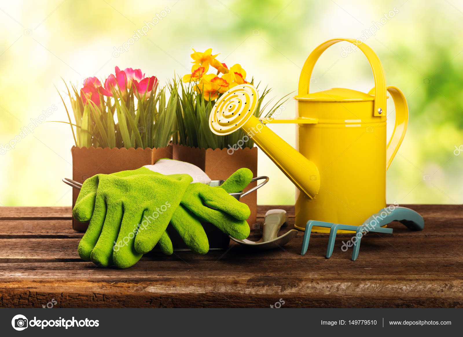 Gardening Tools And Flowers On Old Wooden Table In Garden Stock Gardening Tools And Flowers On Old Wooden Table In Garden Stock Photo
