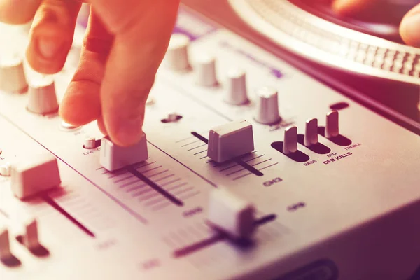 Dj playing and mixing music on turntable controller — Stock Photo, Image