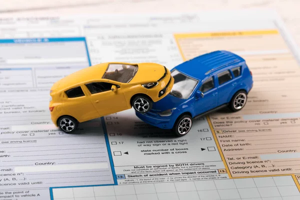 Toy cars on accident statement — Stock Photo, Image