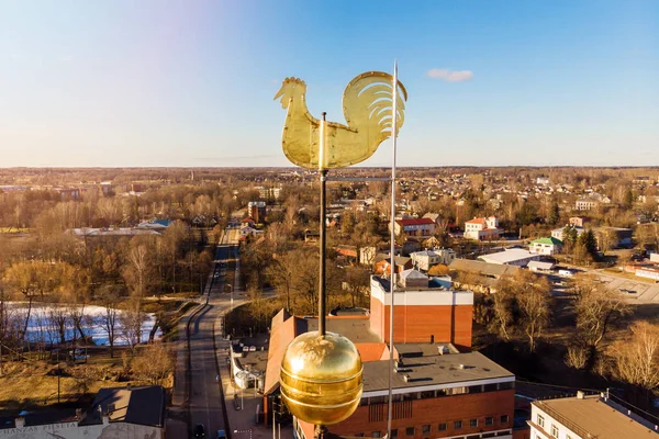 Golden weathercock on the top of the church building — Stock Photo, Image