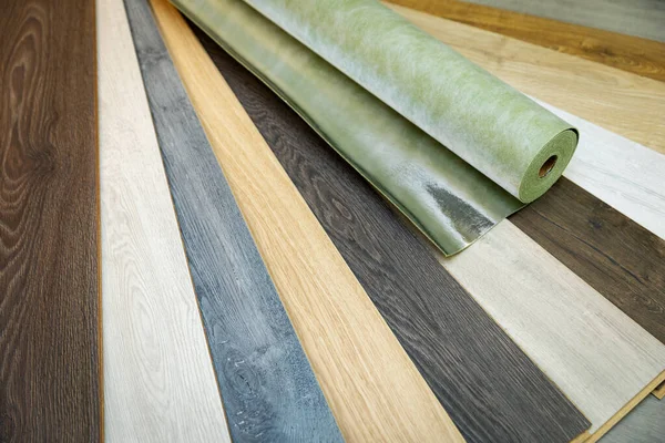 Home improvement - laminate flooring samples and underlay — Stock Photo, Image