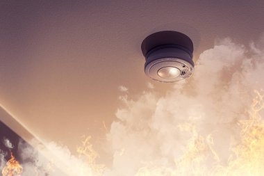 home safety - smoke detector on ceiling detecting house fire clipart