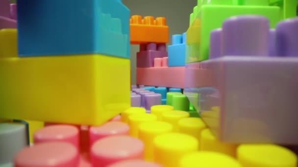 Sliding Colorful Plastic Toy Building Blocks — Stock Video