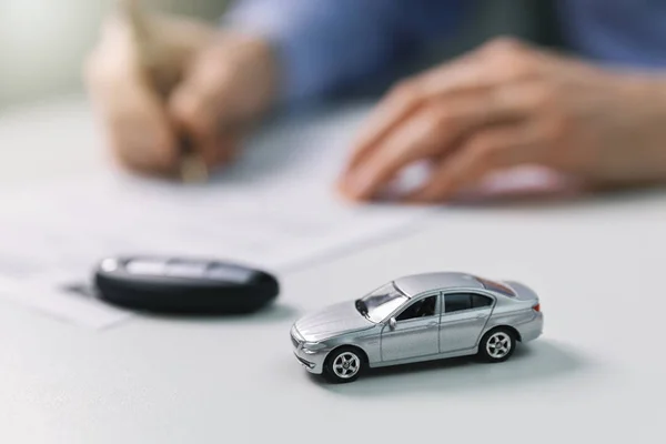 Buy new car concept - signing contract in dealer office — 스톡 사진