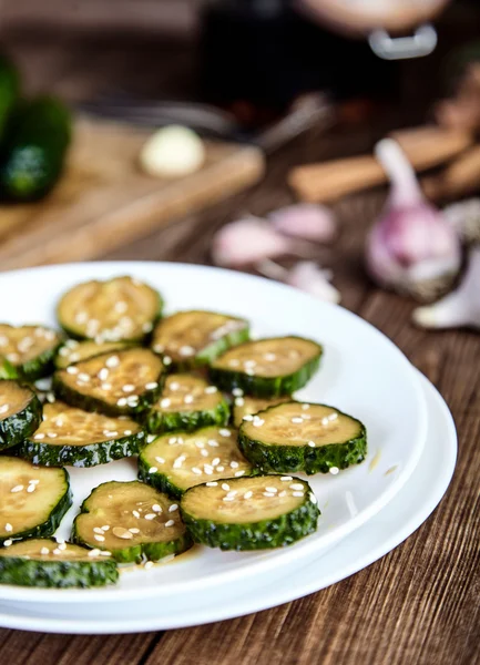 Slices of pickled cucumbers with sesame seeds — ストック写真