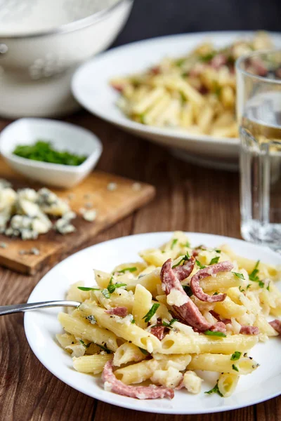 Pasta of Penne rigate, celery and smoked sausage — Stock Photo, Image