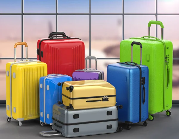 Σκληρό υπόθεση πολύχρωμες βαλίτσες με φόντο το αεροδρόμιο — Φωτογραφία Αρχείου