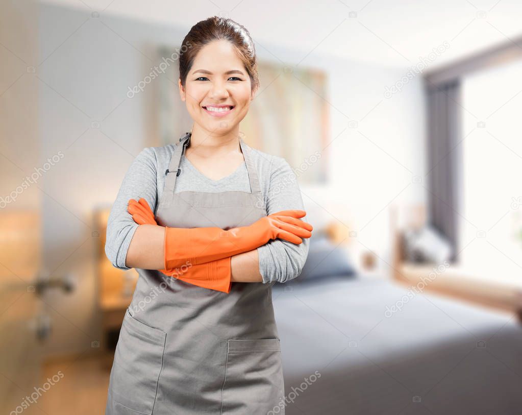 asian housewife wearing rubber gloves crossed arms 