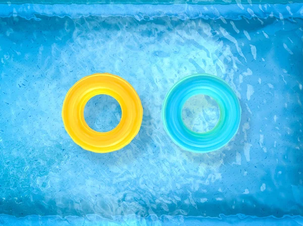 Swim rings on pool — Stock Photo, Image