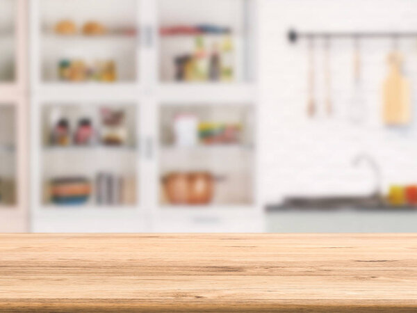 wooden counter with kitchen cabinet background