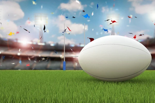 Rugby ball with rugby posts on field — Stock Photo, Image