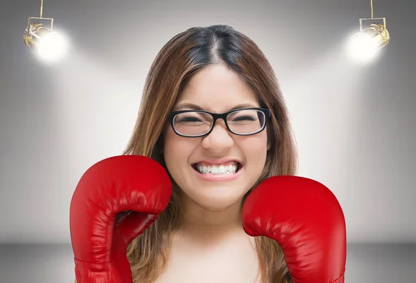 woman fighting with red boxing gloves