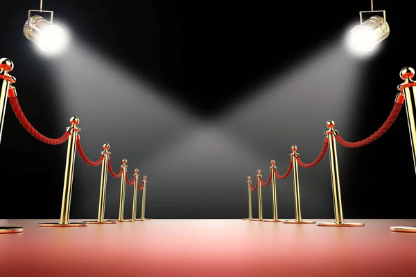 Red carpet and rope barrier with shining spotlights — Stock Photo, Image