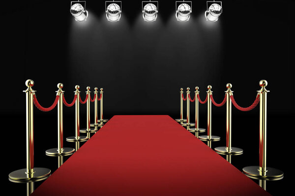 red carpet and rope barrier with shining spotlights